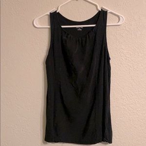 Black sleeveless top.